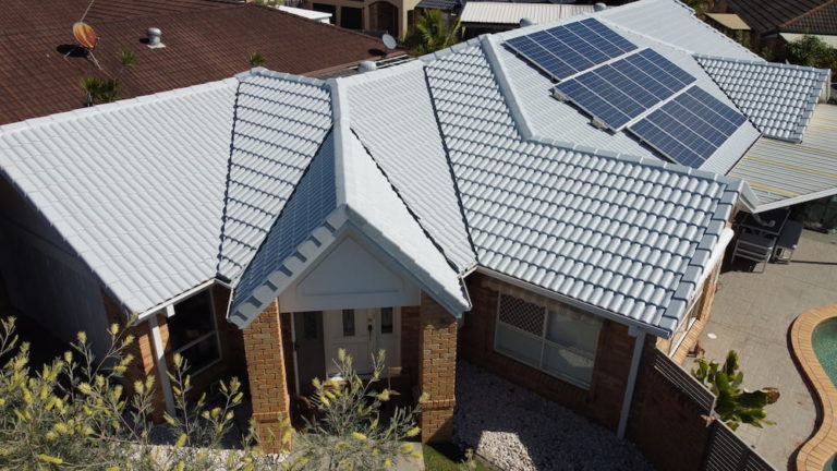 Gray Brick Roof With Solar Panels — Roofers In Gold Coast, QLD